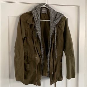 Army green cargo jacket with Grey sweatshirt peek